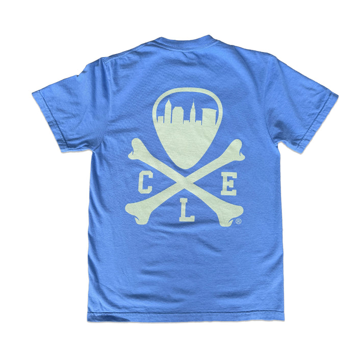 A heather blue short-sleeve t-shirt shown from the back, featuring a large pale yellow graphic of a shield with a skyline, crossed bones, and the letters 'C', 'L', and 'E'.