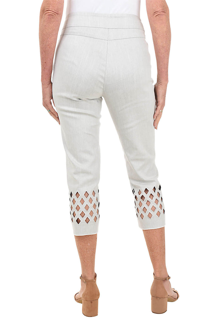 Light grey pants with cut-out details on a white background. Back shot.