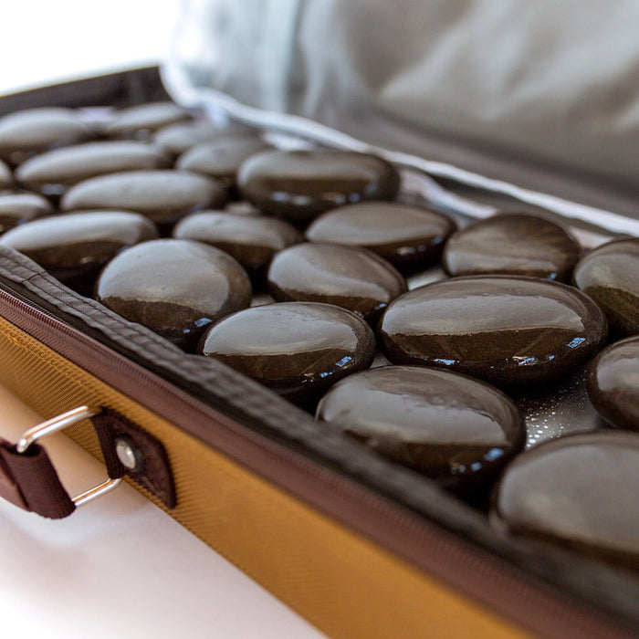 Large Hot Stone Heating Bag with digital controller; Canvas hot stone heating bag open with massage stones; Waterless massage stone heater for professional spa use; Large massage stone heating bag with removable liner; Digital temperature control for hot stone heater; Portable canvas hot stone heating bag; Massage stone heater on treatment cart; Large hot stone heating bag for massage therapy