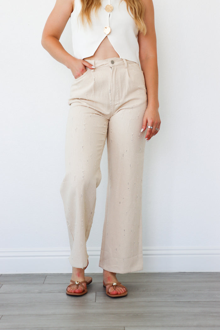 girl wearing cream pants