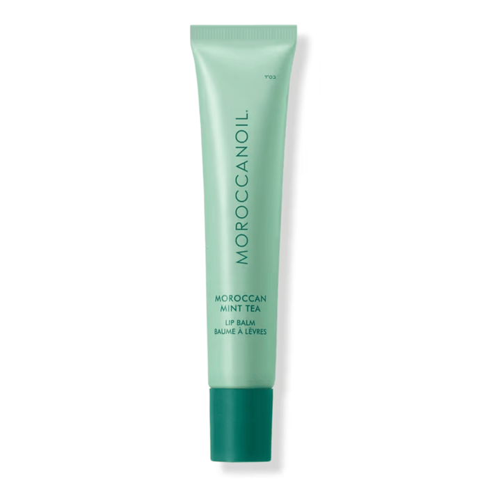 Argan Butter Lip Balm | Moroccanoil in a green tube with Moroccan Mint Tea scent, designed for skincare and lip hydration.