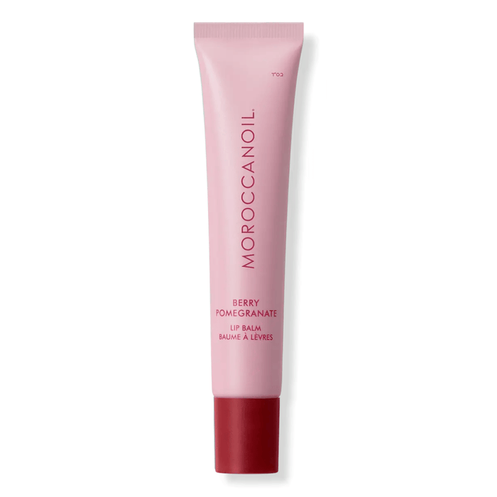 Argan Butter Lip Balm | Moroccanoil in a pink tube with red cap, featuring a berry pomegranate scent designed for skincare and lip hydration.