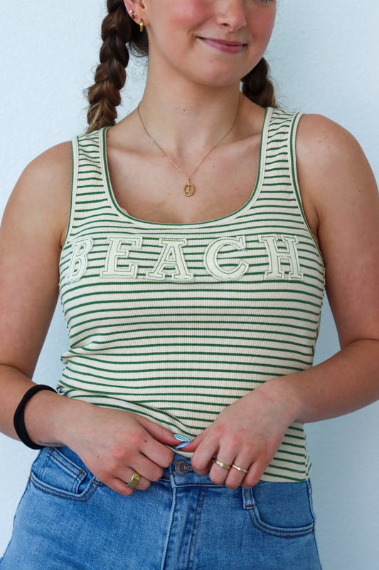 girl wearing green striped "beach" tank top