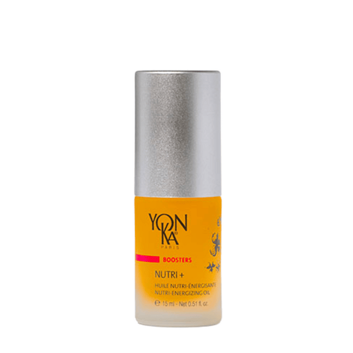 Small bottle of Booster Nutri+ | Yon-Ka Paris, a skincare nutri-energizing oil with a silver cap and amber liquid inside.