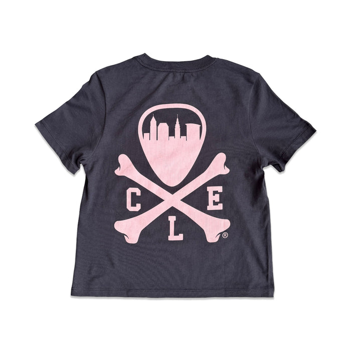 A dark navy blue short-sleeve t-shirt shown from the back, featuring a light pink graphic of a shield with a city skyline, crossed bones, and the letters 'C', 'L', and 'E'.
