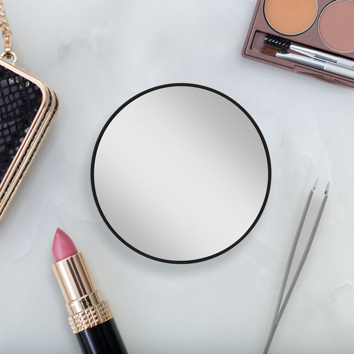 Zadro FC15 705004418546 environment photo on table with makeup tweezers, compact mirror with magnification & suction cup in front of real life setting