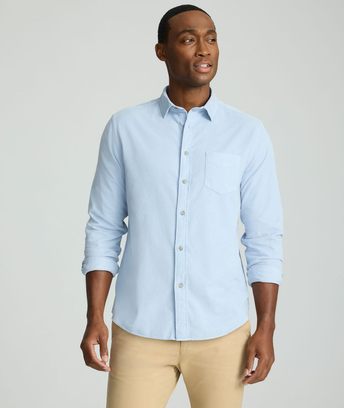 Model is wearing UNTUCKit Cord Shirt in heather blue.