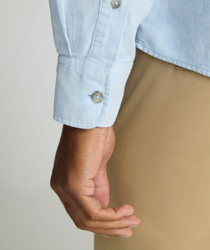 Model is wearing UNTUCKit Cord Shirt in heather blue.