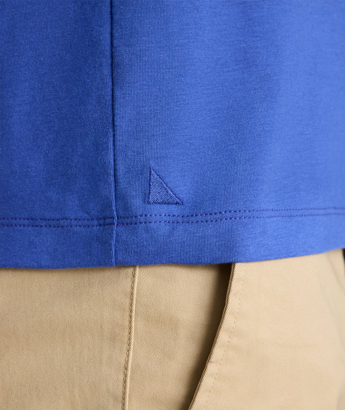 Model is wearing UNTUCKit Glera henley in deep ultramarine.