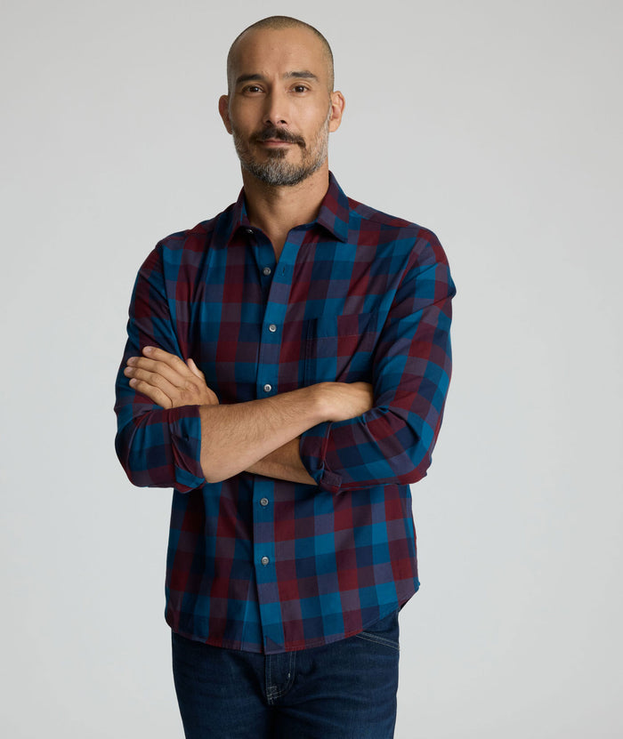 Model is wearing UNTUCKit Heinrich flannel in plaid blue.