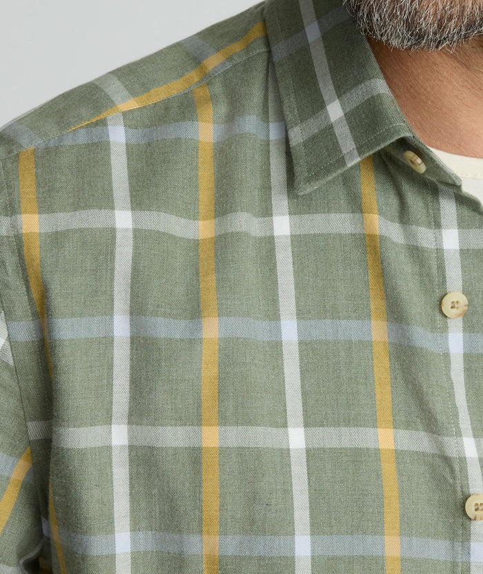 Model is wearing UNTUCKit Silva flannel in green.