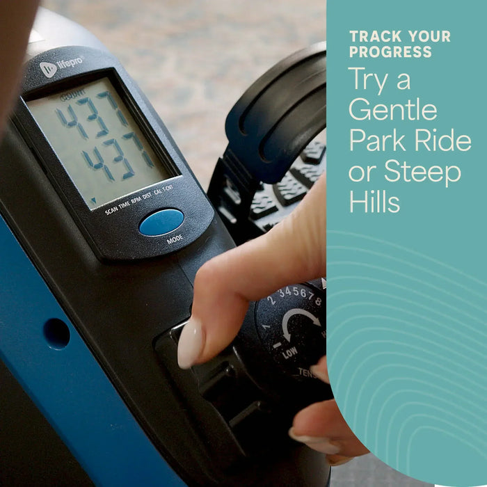 Close-up of the FlexCycle Plus's LCD console showing workout stats, with a hand adjusting the 1-8 tension control dial.