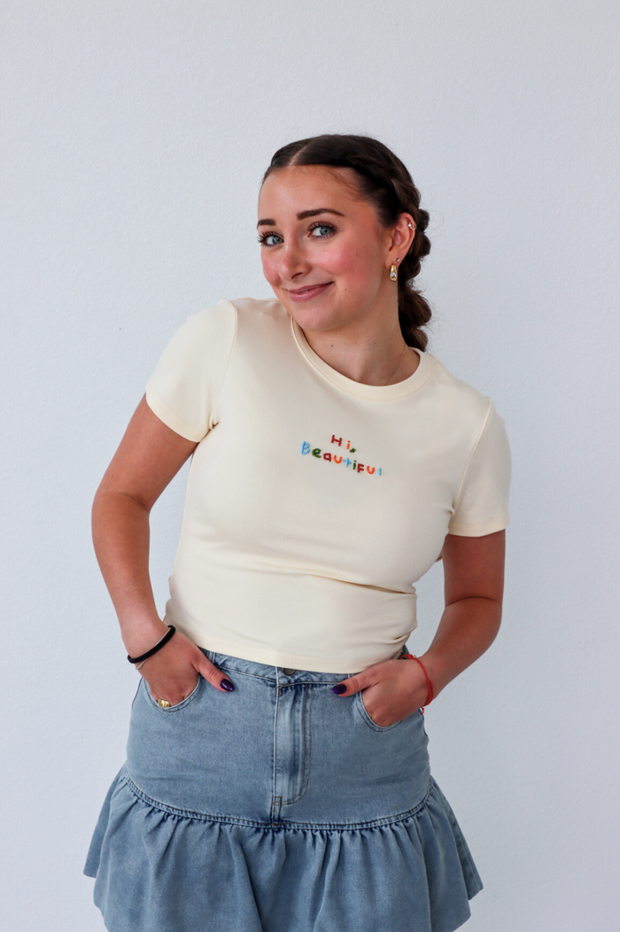 girl wearing cream "hi beautiful" graphic tee