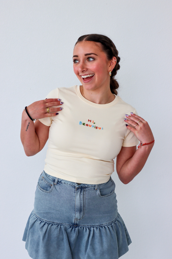 girl wearing cream "hi beautiful" graphic tee