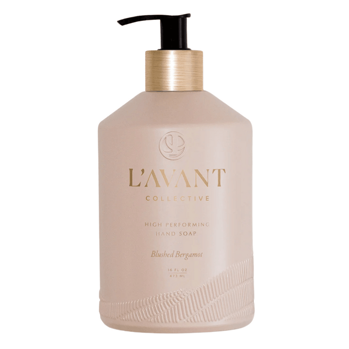 Bottle of High Performing Hand Soap - Blushed Bergamot | L'AVANT Collective in a matte light beige container with a gold pump dispenser, showcasing elegant skincare packaging.