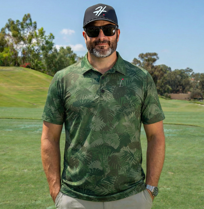 Man Wearing Performance Men's Golf Polo with Various Shades of Green Jungle Palm Fronds