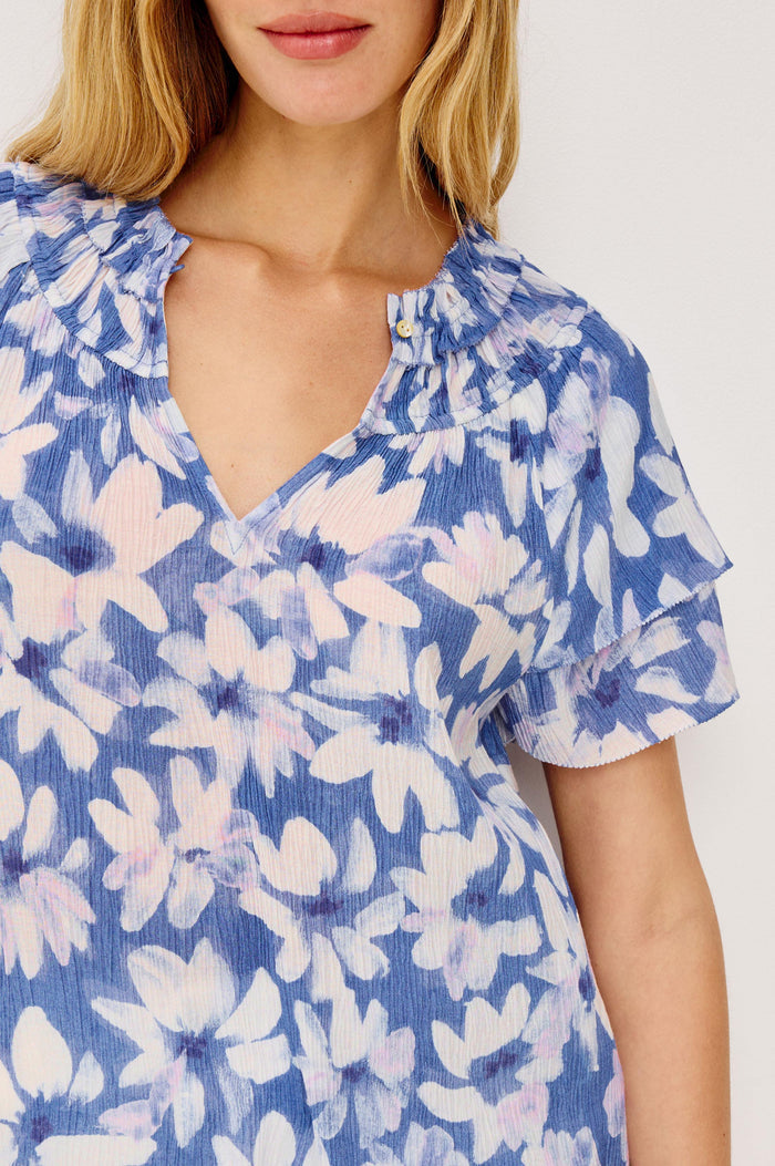 Kamila Top in Chiffon With Elastic Ruffle Collar, V-Neck, and Tiered Flutter Sleeves in Blue Amaranth Colorway - Upper Body Front View Featured on Model