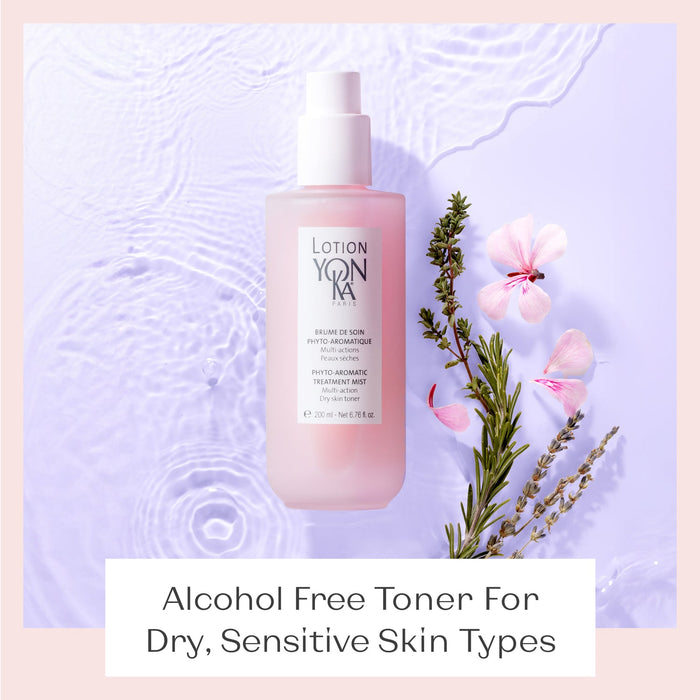 Bottle of Lotion YON-KA PS | YON-KA placed on a light purple watery surface next to sprigs of lavender, rosemary, and pink flowers, highlighting its use as an alcohol-free toner for dry, sensitive skin.
