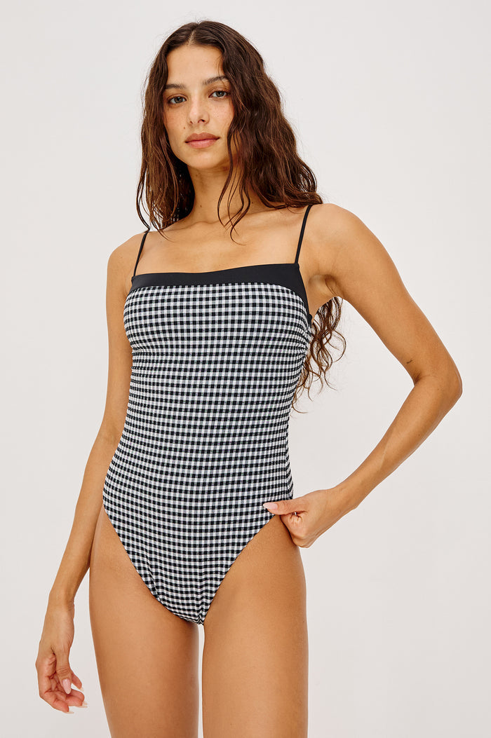 Marbella One Piece Swimsuit With Straight Neckline, Adjustable Shoulder Straps, and Classic Rear Coverage in Black White Gingham Colorway - Upper Body Front View Featured on Model