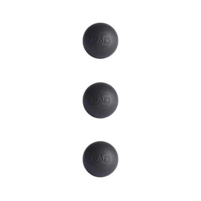 Three black massage balls with embossed RAD logo, designed for targeted muscle relief and recovery, shown on a white background for the Micro Rounds | RAD product.