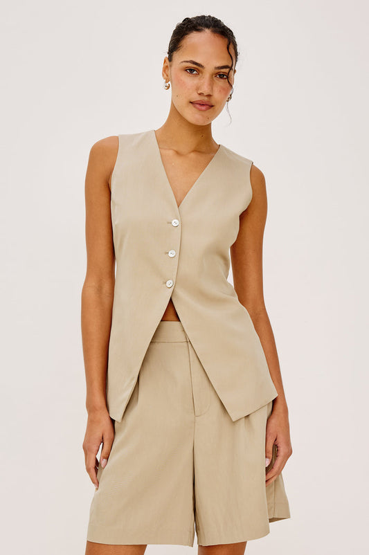 Mylah Vest in Viscose Suiting With V-Neckline, Front Buttons, and Slightly-Loose Fit Tapered at Waist in Almond Colorway - Upper Body Front View Featured on Model