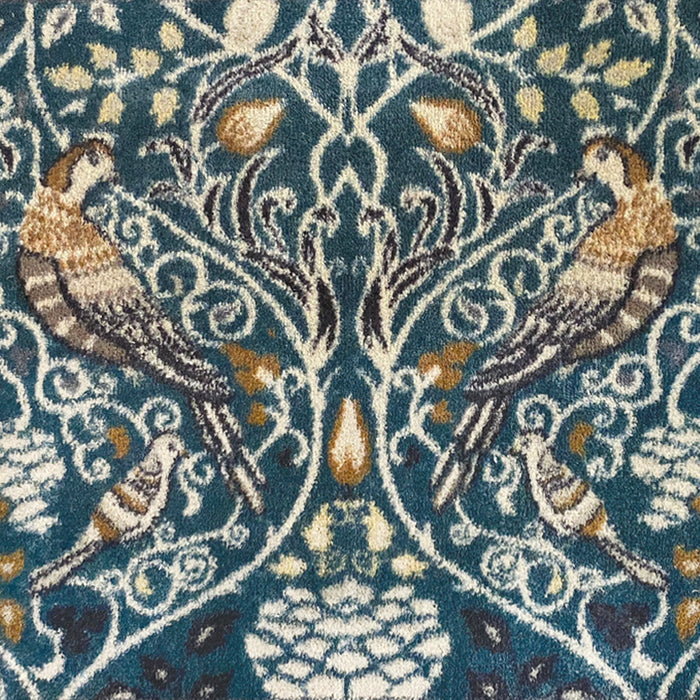 Nature 25 Washable Runner- a 100% recycled cotton runner featuring birds in off-white, beige, brown, and black among foliage.