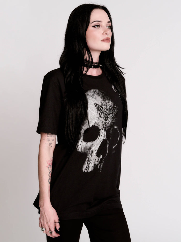 A black t-shirt with a large white skull graphic on the front.