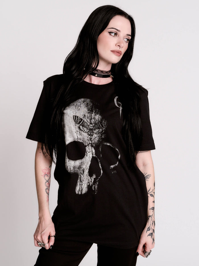 A black t-shirt with a large white skull graphic on the front.