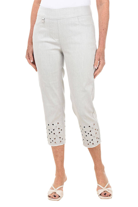Light gray pants with decorative cut-out details on a white background