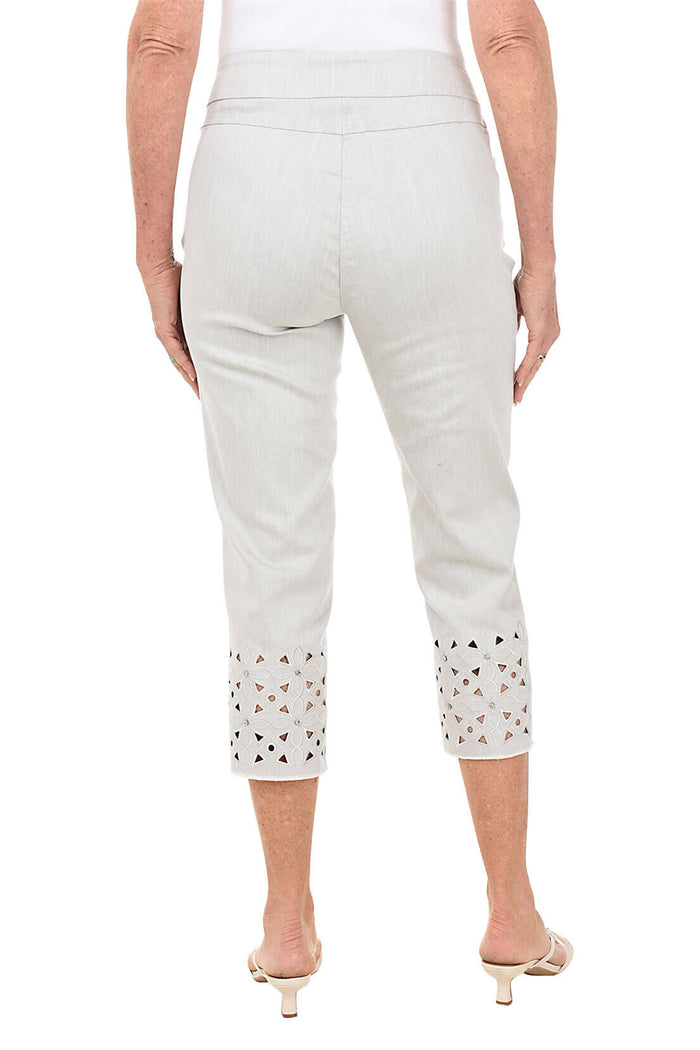 Light gray pants with decorative cut-out details on a white background. Back shot.