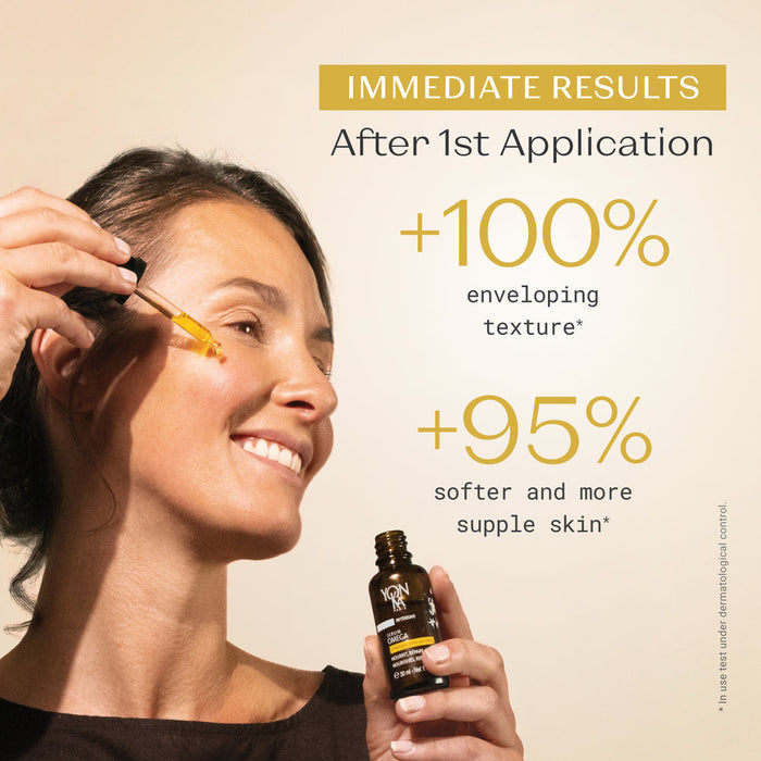 Woman applying serum to her cheek holding a brown bottle of Serum Omega | Yon-Ka Paris with text highlighting immediate skincare benefits after first use.