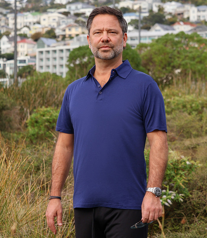 Men's Silkspun Short Sleeve Polo Shirt on model in Navy