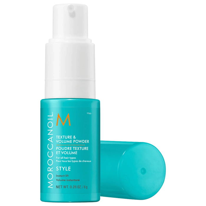Texture and Volume Powder | Moroccanoil in a teal pump bottle with a matching cap, designed to provide instant lift and style for all hair types.