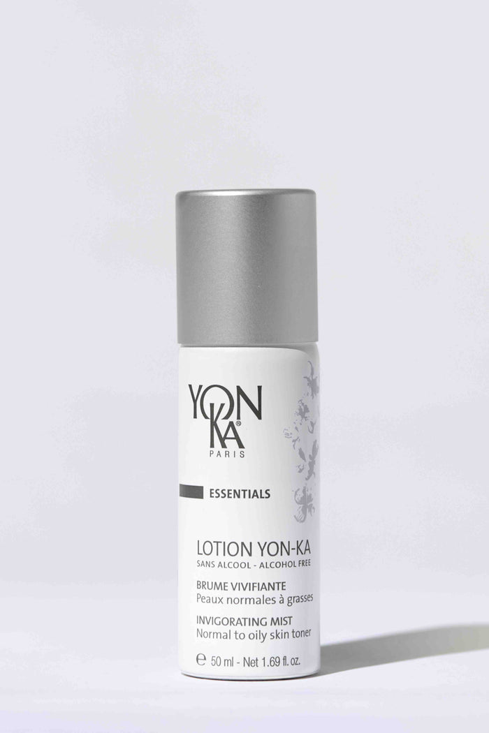 White bottle of Travel Lotion Yon-Ka PNG | Yon-Ka Paris with silver cap, designed as an alcohol-free invigorating mist for normal to oily skin, photographed on a light background.
