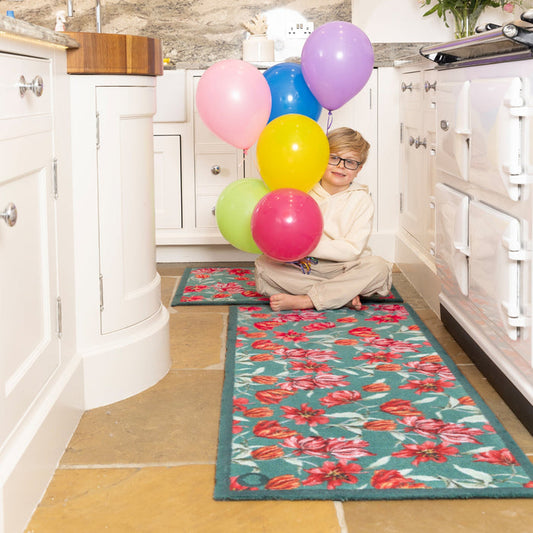 Tumbling Tulips Washable Runner- a 100% recycled cotton runner featuring tulips in red and pink.
