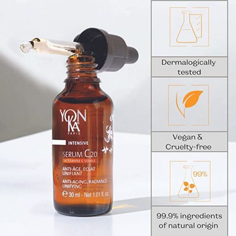 Serum C20 | Yon-Ka Paris in a brown glass dropper bottle highlighting skincare benefits such as anti-aging, radiance, vegan and cruelty-free formula with 99.9% natural origin ingredients.
