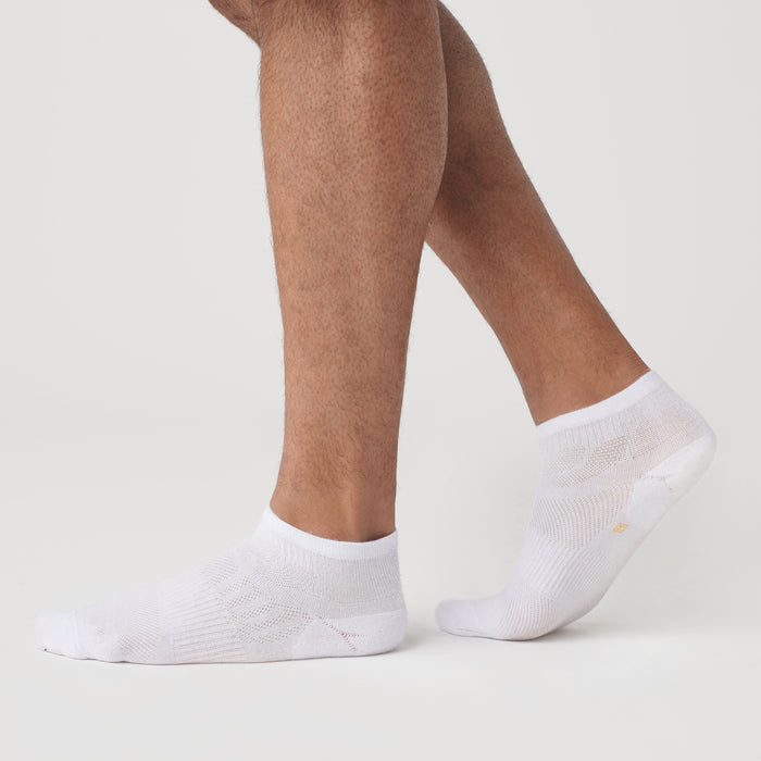 White Ankle Socks 12-Pack on feet against a white background.
