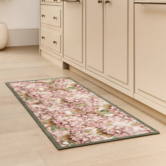 Wild Hydrangea Washable Runner- a 100% recycled cotton runner featuring hydrangea blooms in rust and soft pinks.