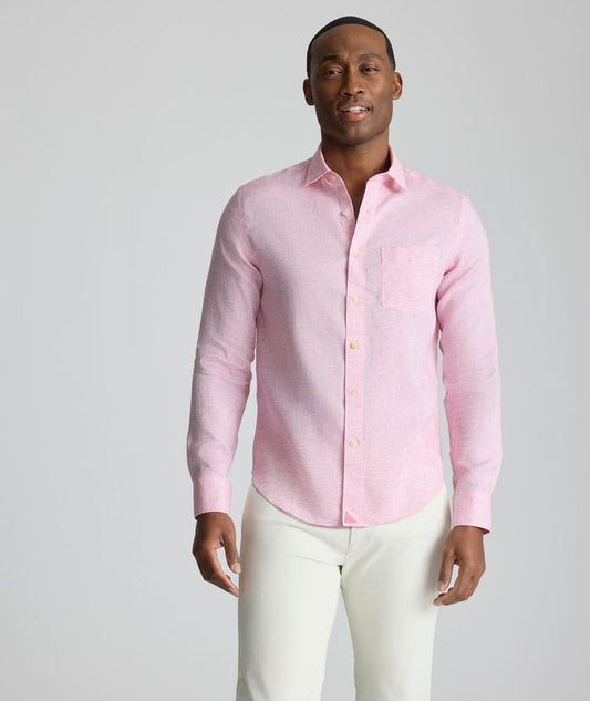 Model is wearing UNTUCKit Wrinkle-Resistant Linen Wildehart Shirt in pink.